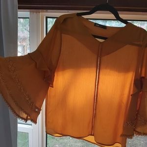 Mustard colour top with bell sleeves